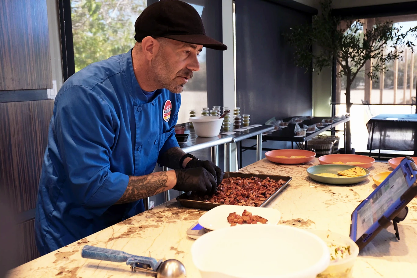 A Live In Fitness chef preparing a meal